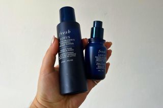 amelia holding fresh lotus toner and dream serum bottles