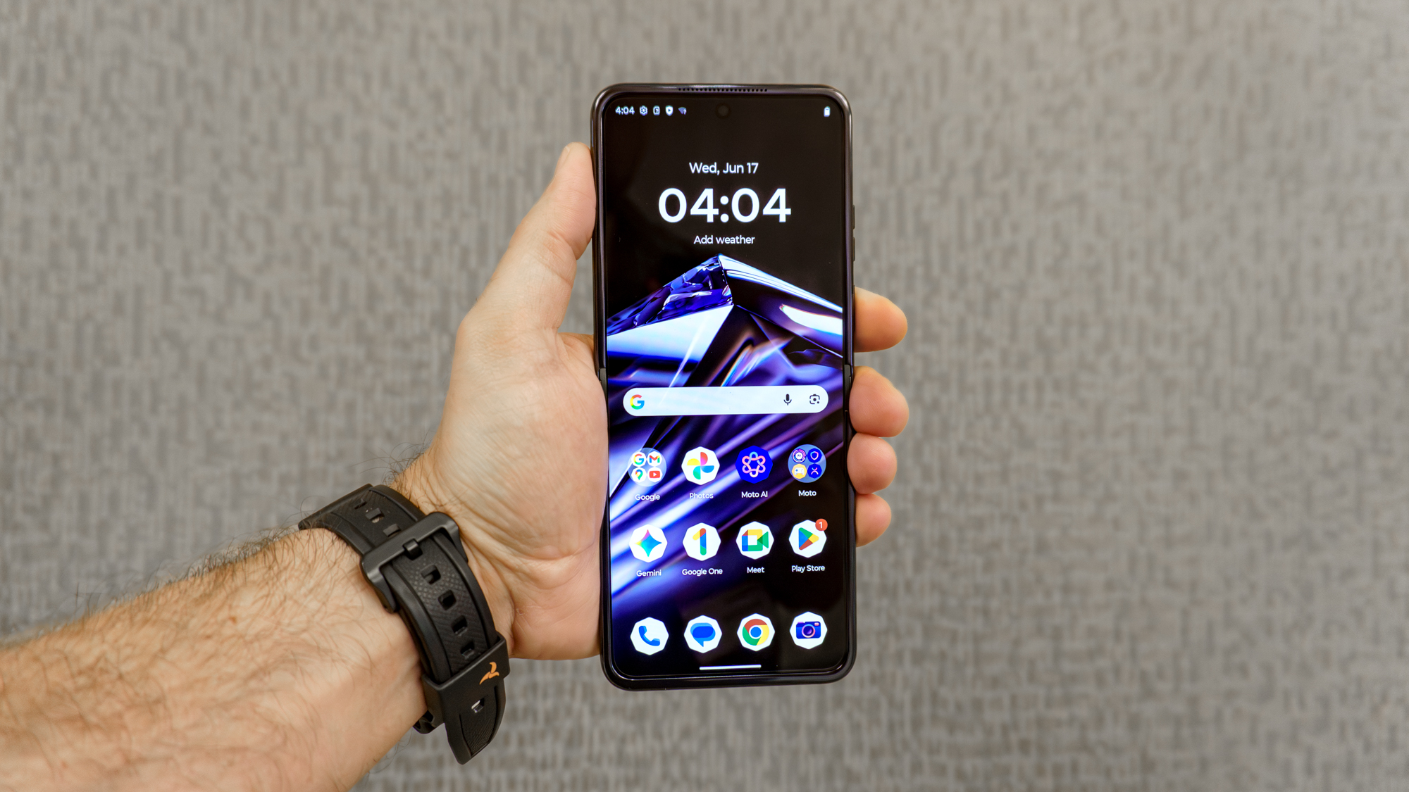 The Motorola Razr with Crystals by Swarovski opened in hand
