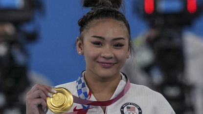 tokyo, japan july 29 sunisa lee of team united states poses with her gold medal after winning the womens all around final on day six of the tokyo 2020 olympic games at ariake gymnastics centre on july 29, 2021 in tokyo, japan photo by laurence griffithsgetty images