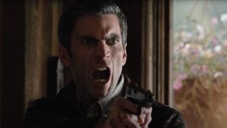 Jamie yelling and pointing gun at Garrett on Yellowstone