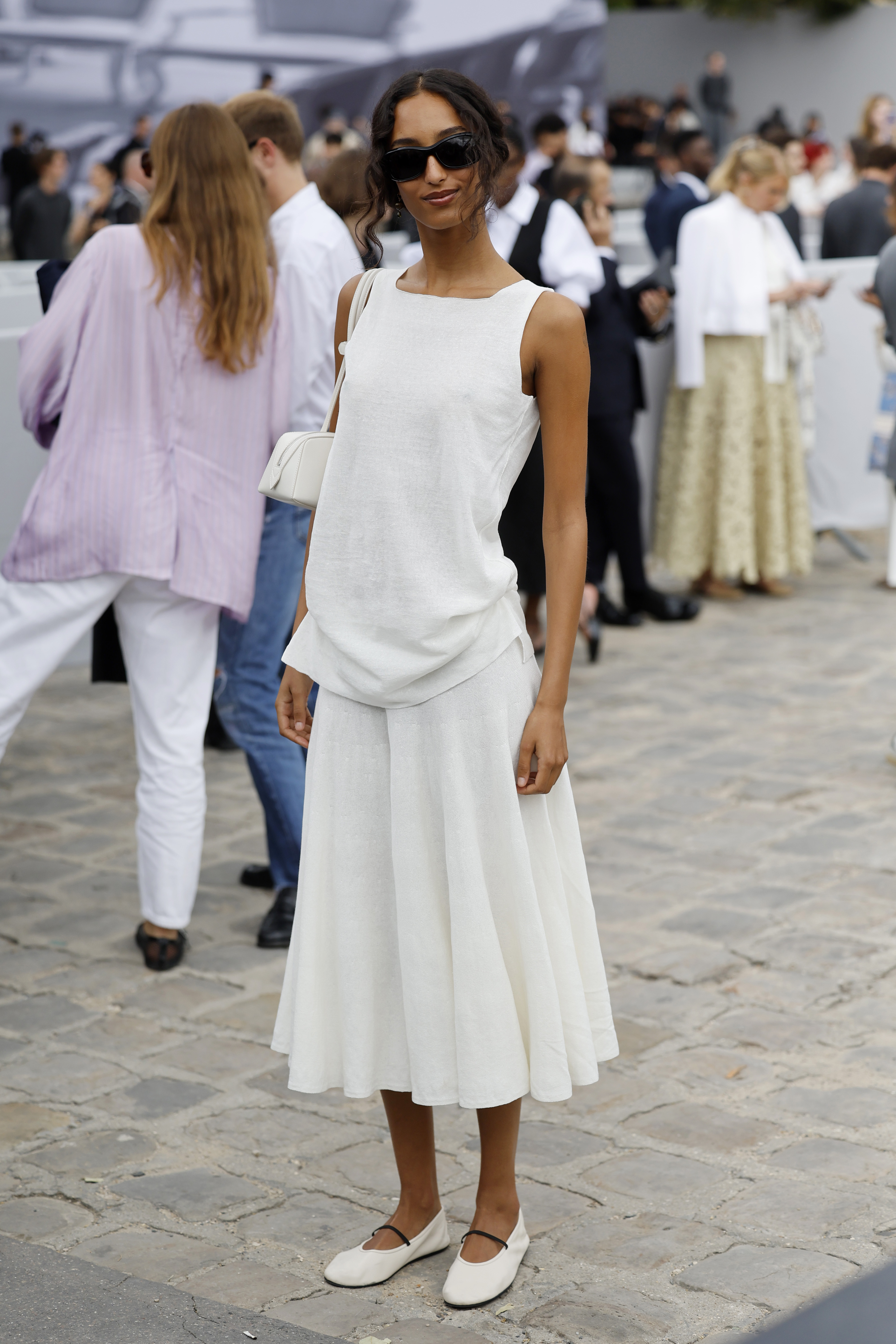 woman wearing white skirt and white top