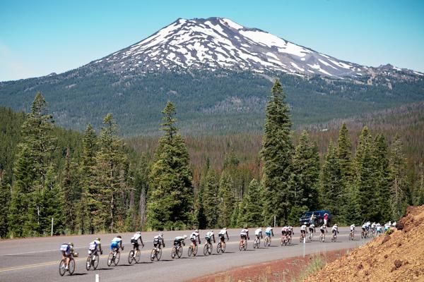 Part of the field heads toward the looming Mount Bachelor.