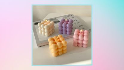 Pastel cube candles on a pastel background