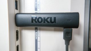 The Roku Streaming Stick 4K Plus plugged into an HDMI port