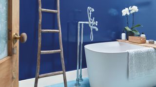 A bathroom in bold blue to illustrate the paint color trends for bathrooms