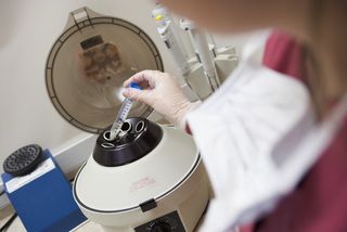 Test tube and centrifuge at fertility clinic