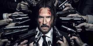 John Wick poster guns facing at Keanu Reeves