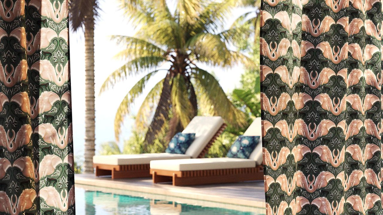 tropical hotel pool with two wooden loungers and palm trees with patterned curtains hung either side of the doorway onto the view