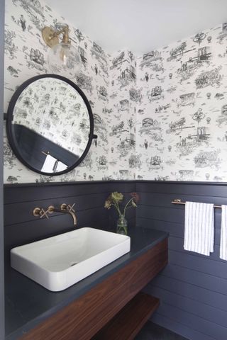 bathroom with toile wallpaper