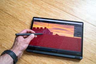 Asus ProArt PX13 laptop on a wooden surface