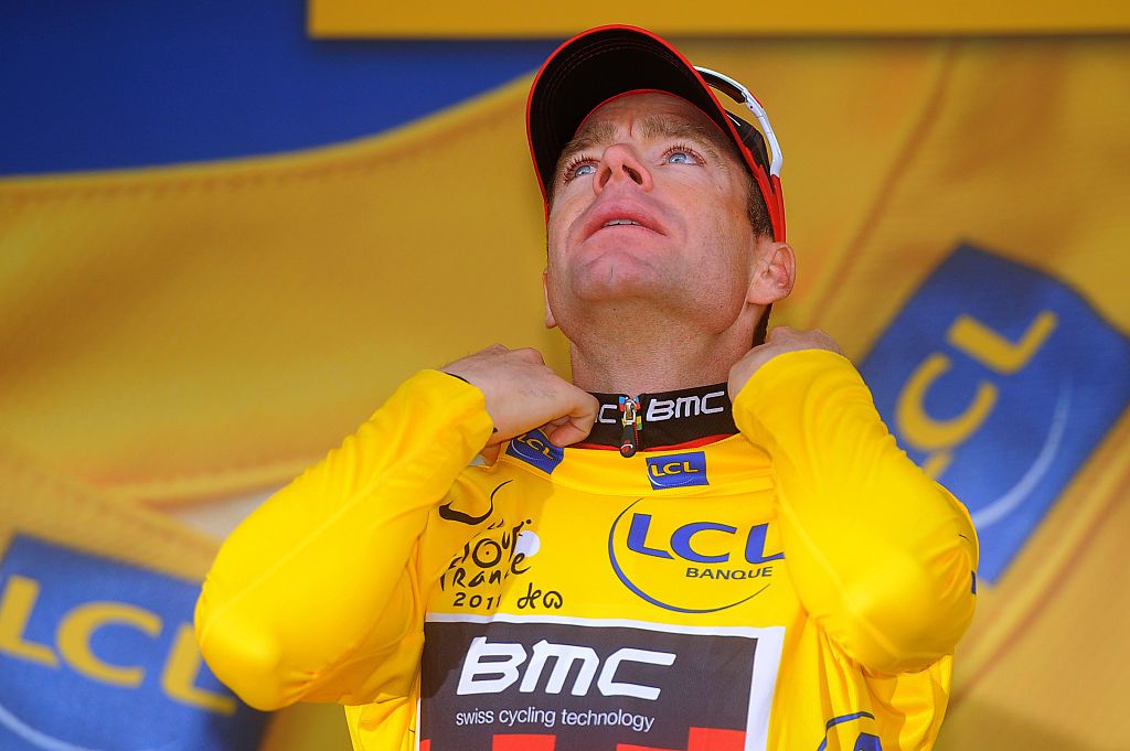 BMC's Cadel Evans pulls on the yellow jersey after second place &ndash; behind Tony Martin &ndash; on stage 20 time trial at the 2011 Tour de France. They next day, he'd be confirmed at Australia's first Tour winner