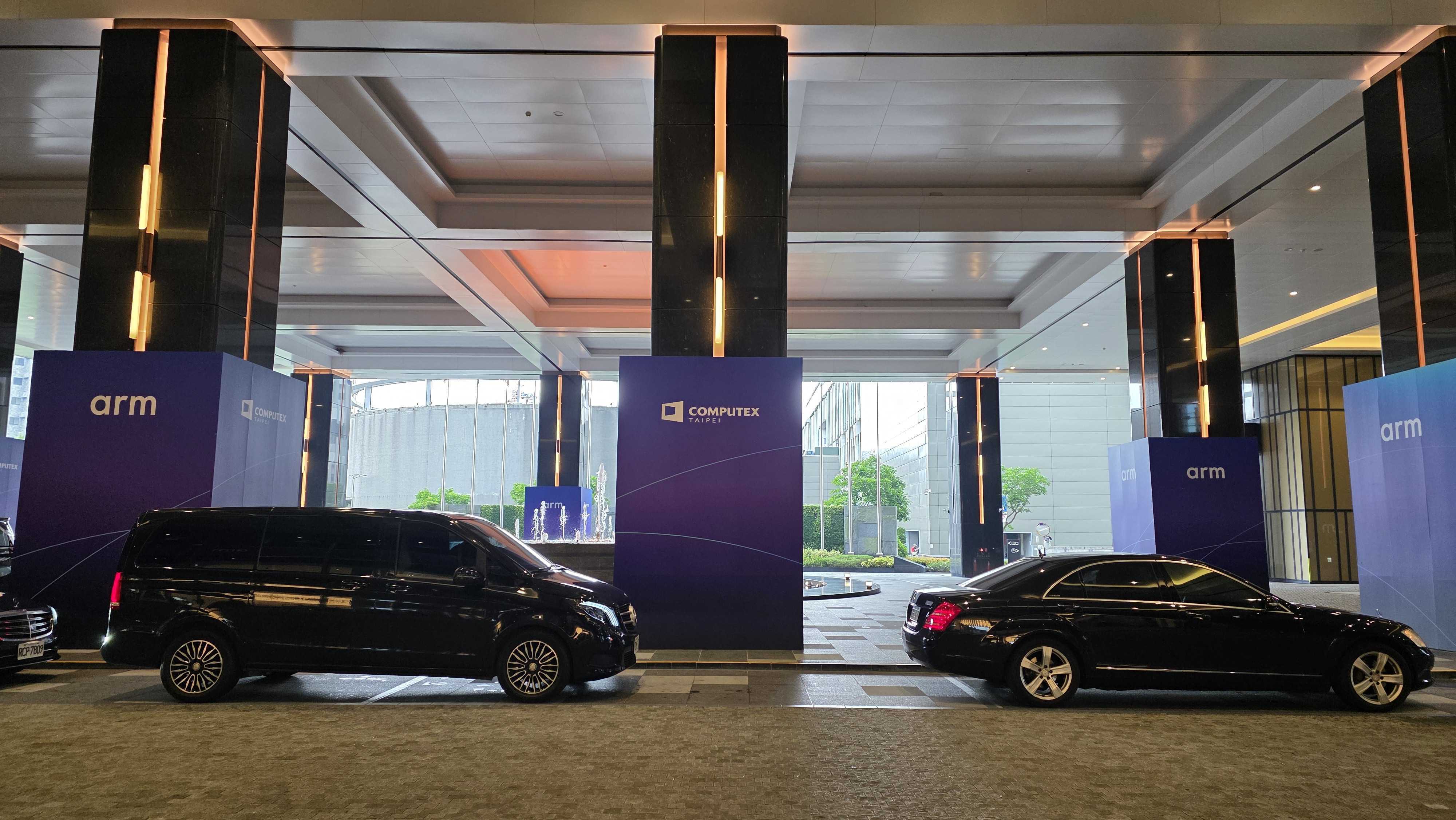 Black car and van outside a hotel at computex