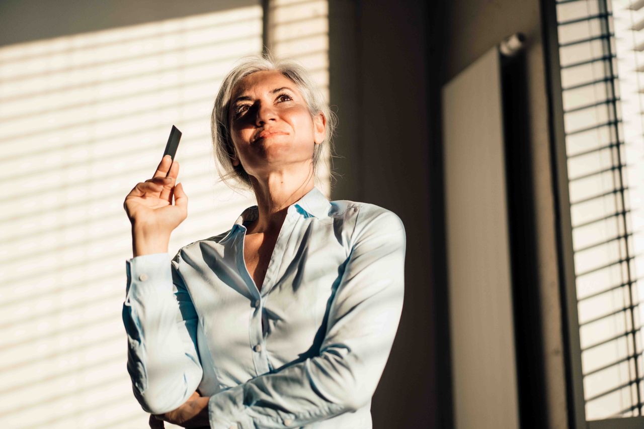 woman holding a credit card