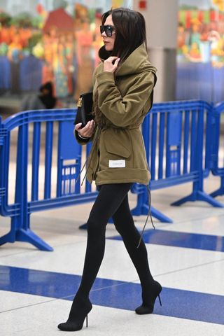Victoria Beckham, Balenciaga, heels, high heels, boots, black boots, pantaboots, airport style, airport outfit, travel, travel style, travel outfit