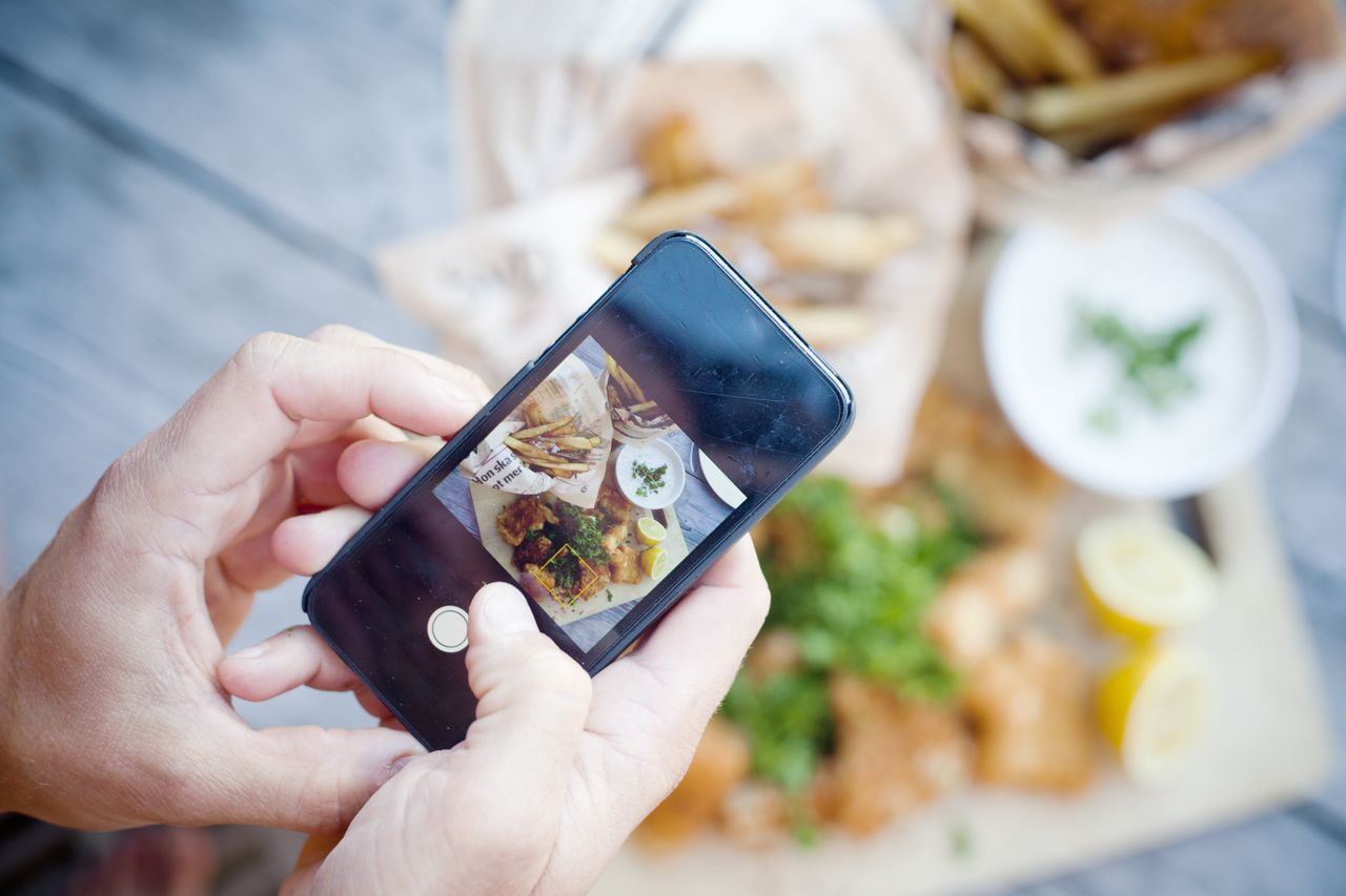 Photographing a meal of fish and chips