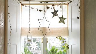 Window with Christmas decorating ideas hanging