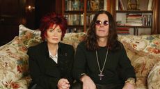 sharon and ozzy osbourne on the floral sofa in their living room