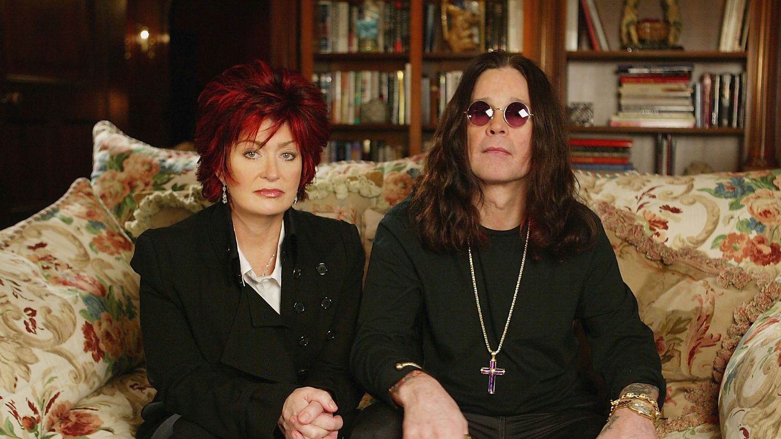sharon and ozzy osbourne on the floral sofa in their living room