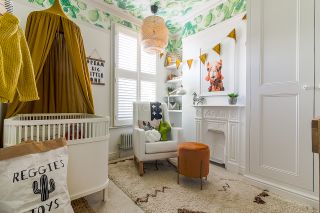 Nursery with cactus wallpapered ceiling