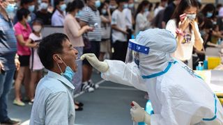 A resident receives nucleic acid test for the Covid-19 coronavirus in Nanjing, in eastern Jiangsu province on July 21, 2021.