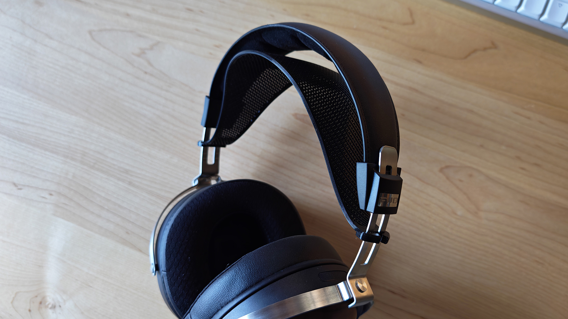 Various photos of the FiiO FT1 headphones, in a home office. 