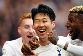 Son Heung-min (centre) celebrates his second goal of the game for Tottenham