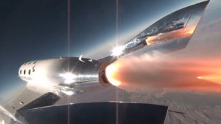 a cone of orange flame erupts from the back of a silvery-white space plane, with earth and a blue-black sky in the background.