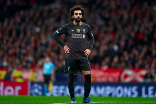 Mohamed Salah of Liverpool FC looks on during the UEFA Champions League round of 16 first leg match between Atletico Madrid and Liverpool FC at Wanda Metropolitano on February 18, 2020 in Madrid, Spain.