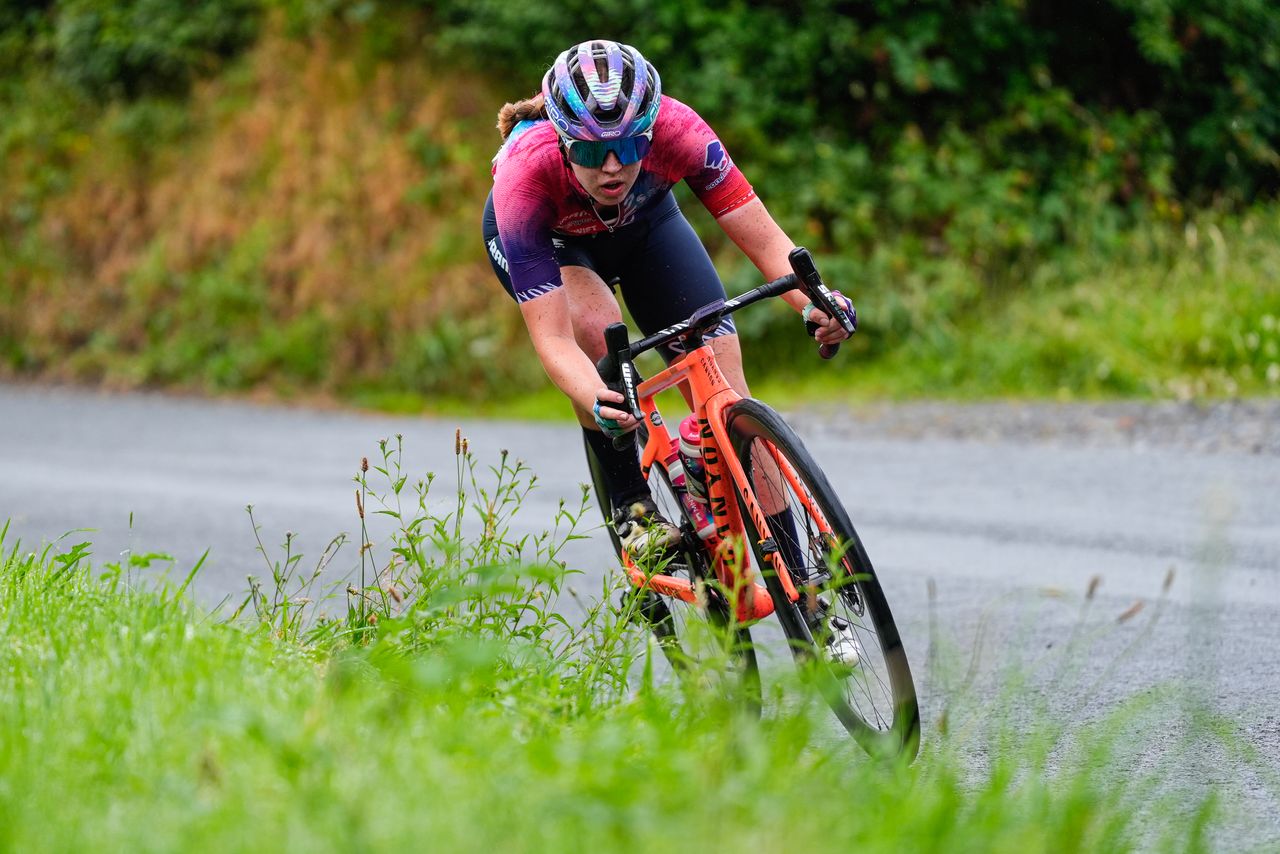 Awen Roberts rides her bike downhill
