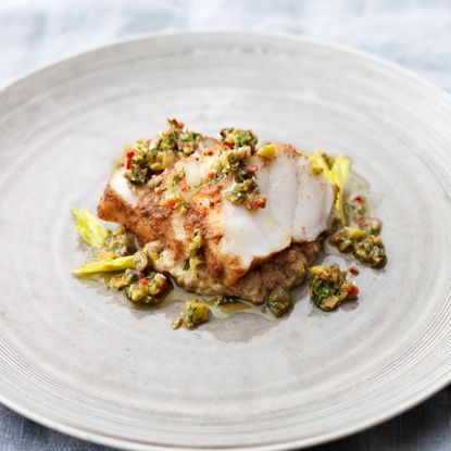 roasted monkfish with cumin and baked aubergine puree photo