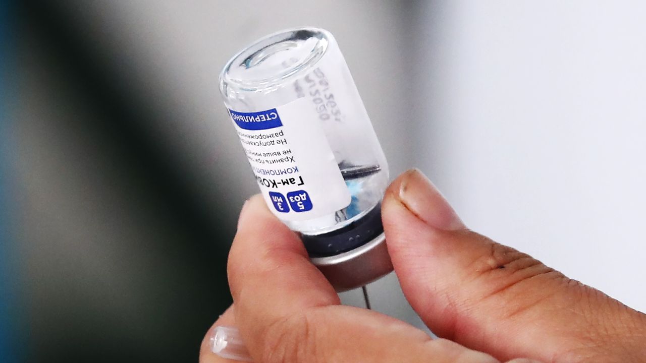 A health worker prepares a dose of the Sputnik V vaccine.