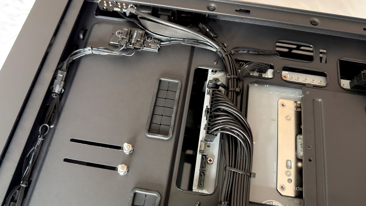 A close-up photo of the internal cable management of a Maingear MG-1 Mk.II gaming PC