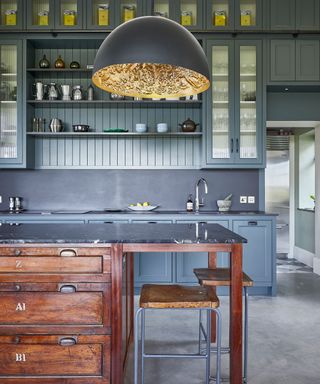 Kitchens by Holloways with a kitchen island made from a vintage chest