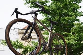 A gravel bike secured to a roof rack