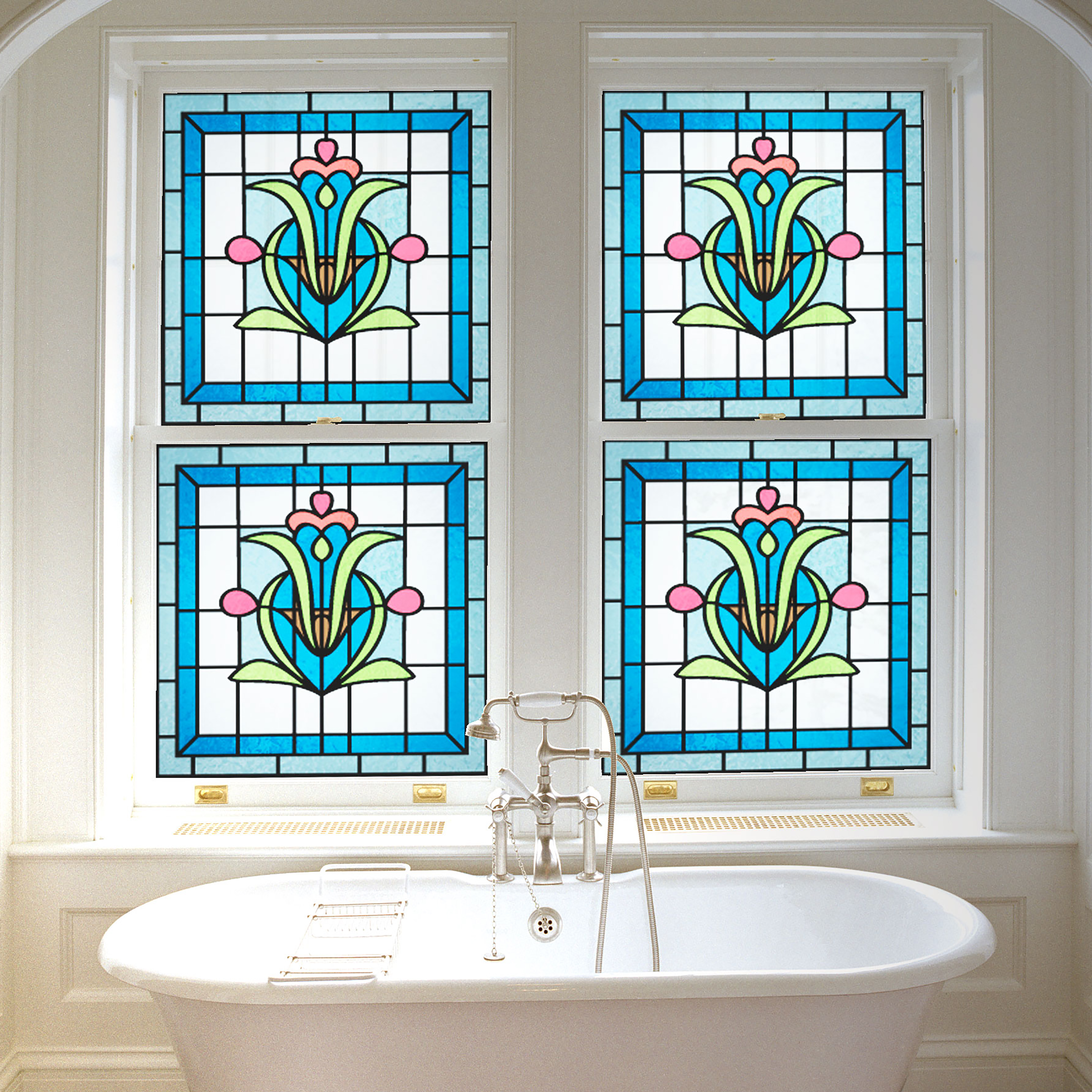 bathroom with freestanding bath and large windows covered with stained glass effect from purlfrost