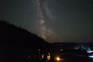 The stars of the Milky Way stretched across the sky above us during a trip to the Central Idaho Dark Sky Reserve during the 2018 Perseid meteor shower. The only lights came from the car and the small citronella candles lit to keep any bugs at bay.