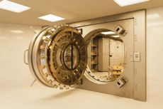 An open, golden bank vault door.