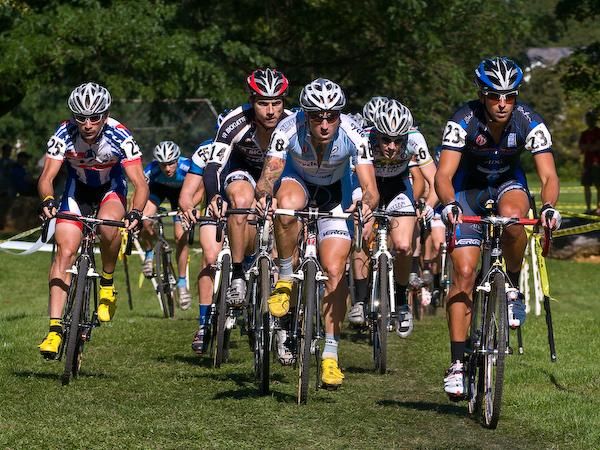 Weston Schempf (C3-Athletes Serving Athletes) leads the elite men field as they accelerate on the opening lap.