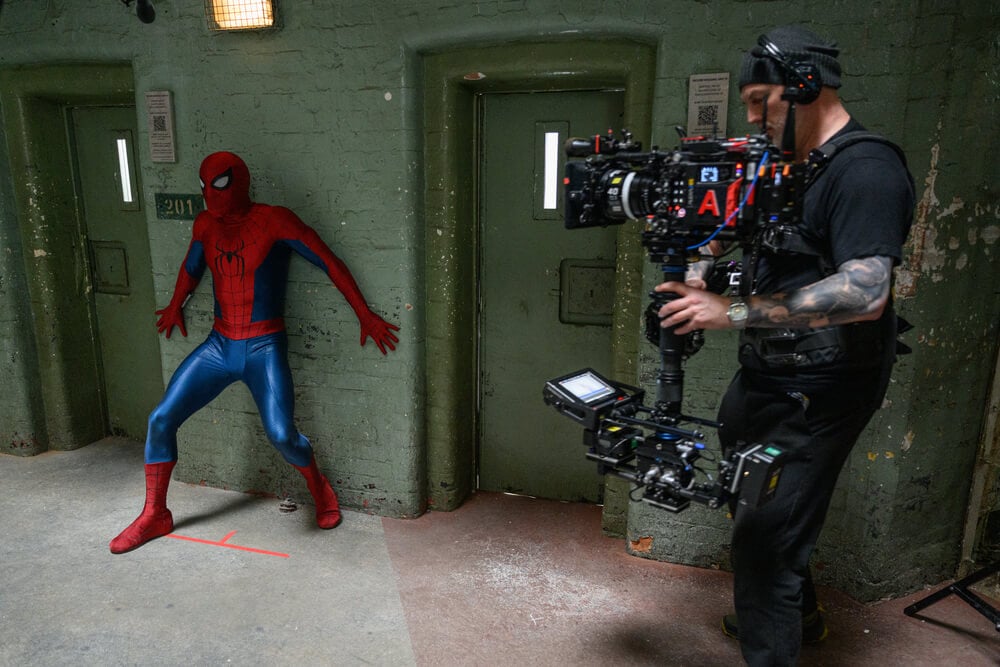 Set photos from Spider-Man: Brand New Day showing crew filming with an Alexa 265 and a custom Panavision lens