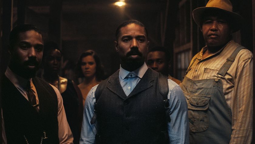 Michael B. Jordan as Smoke and as Stack in doorway in Sinners