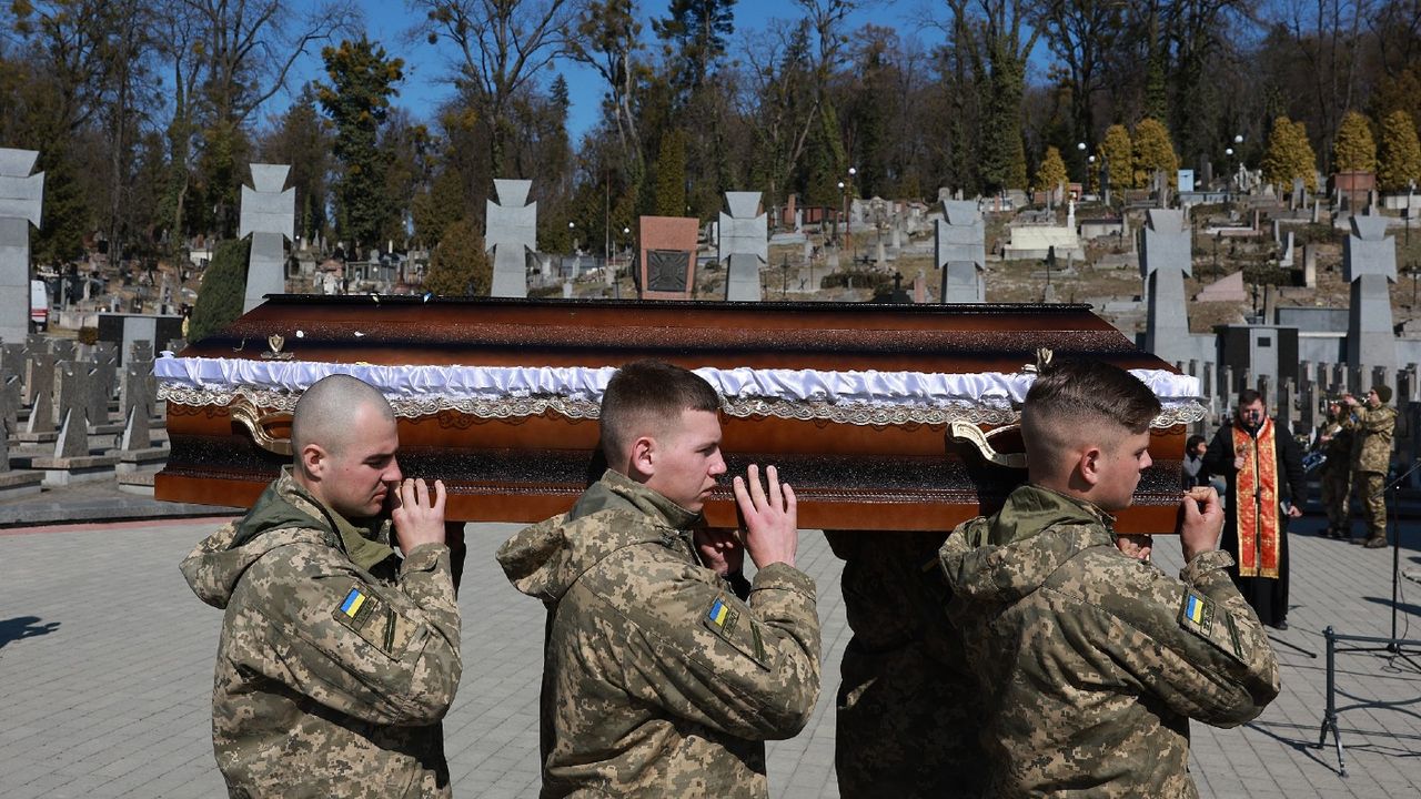 Men carrying casket