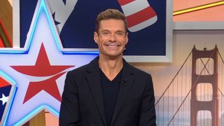 Ryan Seacrest hosting Coca Cola 250 episode of Wheel of Fortune