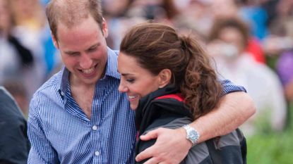 Prince William and Kate Middleton embrace and smile