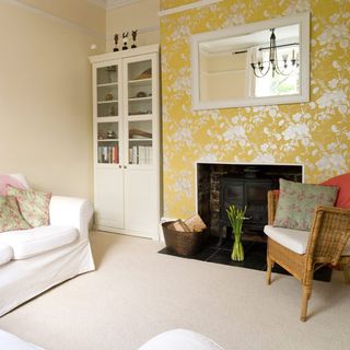 living room with yellow wallpaper and carpet flooring