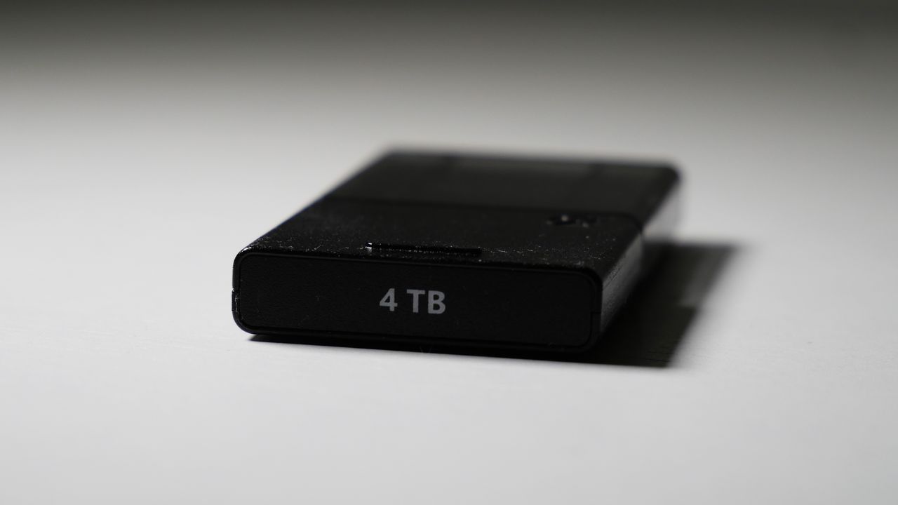 4TB Seagate Storage Expansion Card on a white desk, highlighting its light-and-thin design.