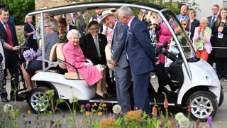 Queen Elizabeth II is given a tour by Keith Weed, President of the Royal Horticultural Society during a visit to The Chelsea Flower Show 2022 at the Royal Hospital Chelsea on May 23, 2022 in London, England