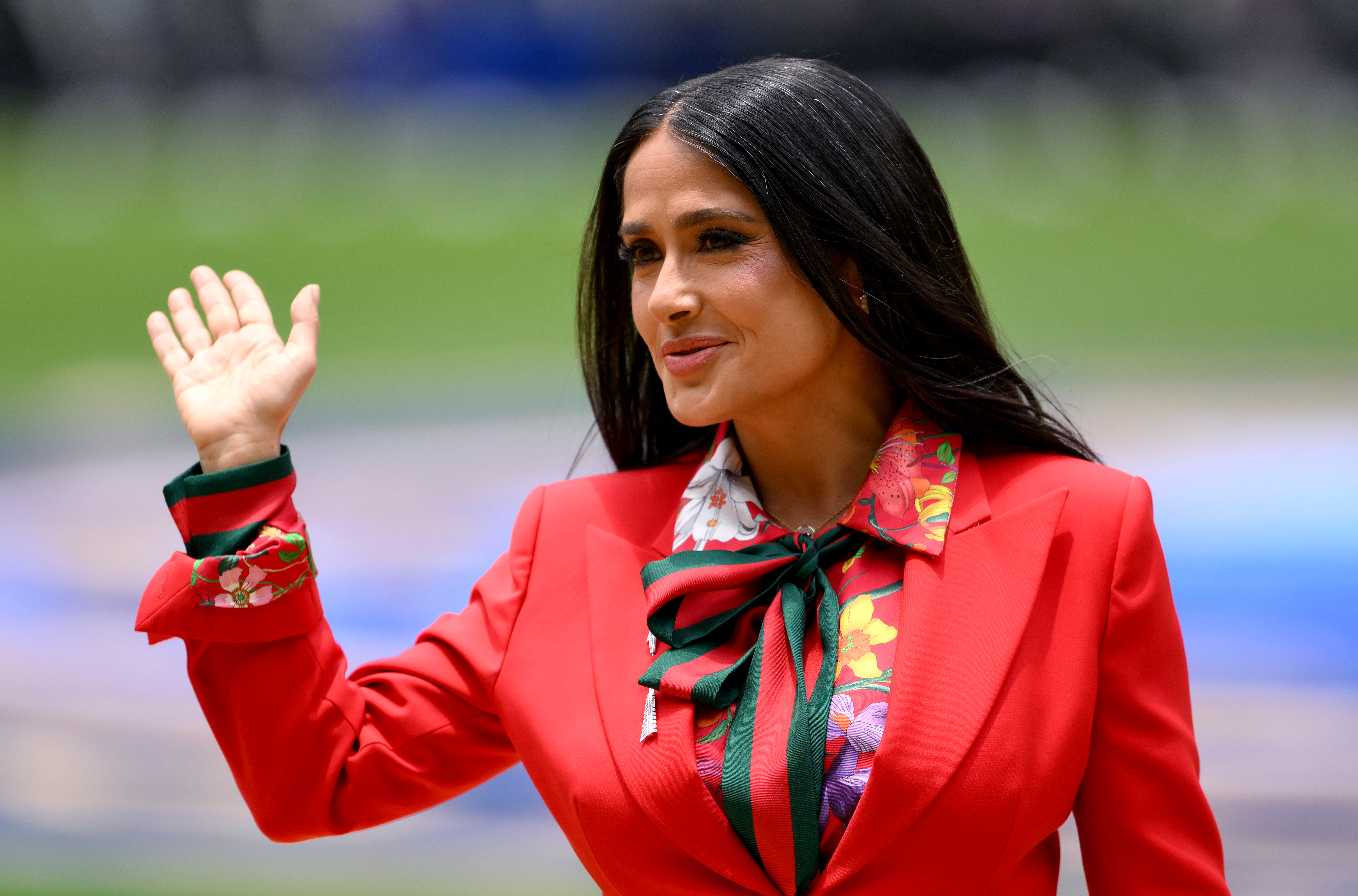 Salma Hayek opened the 2026 World Cup in a custom strawberry red suit from Gucci