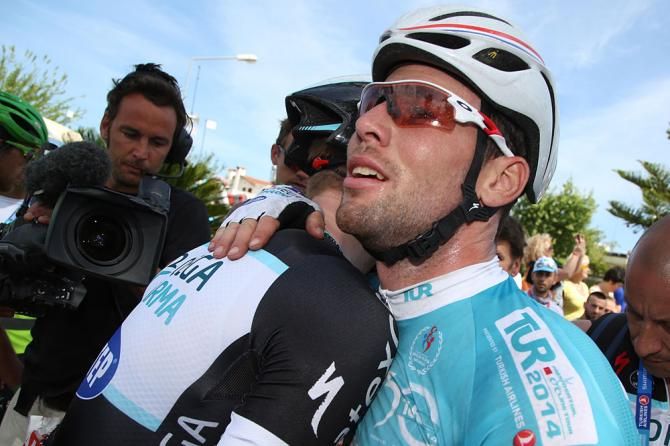 Mark Cavendish gets hugged after his stage win