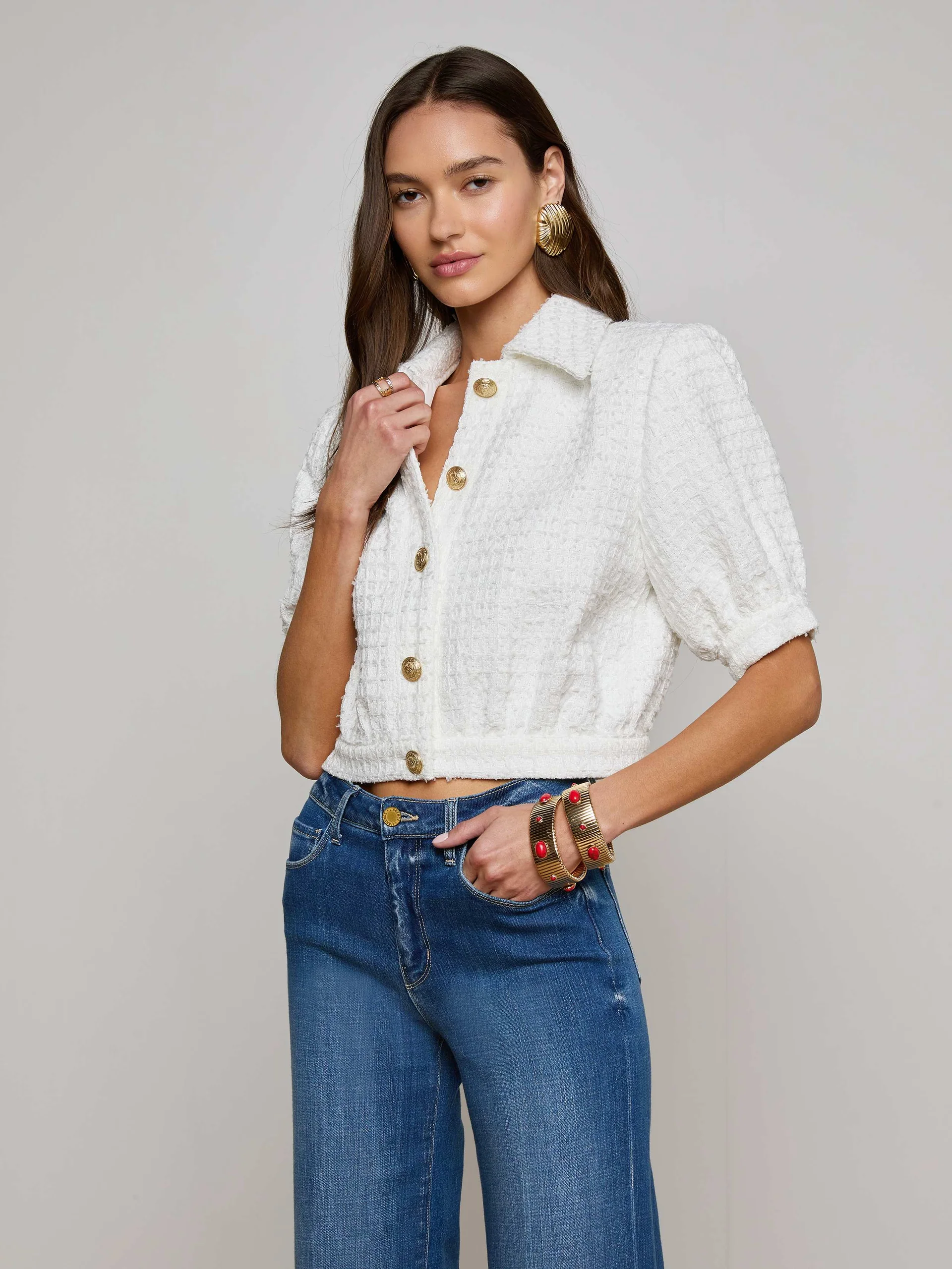 A model wearing a white blazer