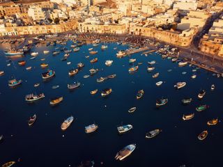 Aerial view of the boats at Marsaxlokk harbour in Malta. A fishing village in the south of Malta